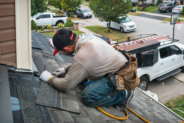 Professional Roofing technician working in Fowlerville, MI
